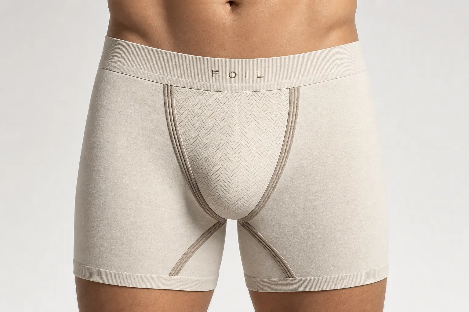 FOIL Standard™ biomechanical underwear — front view showing the dynamic air-gap, anti-sag suspension vectors, airflow chevrons, and 3D pouch